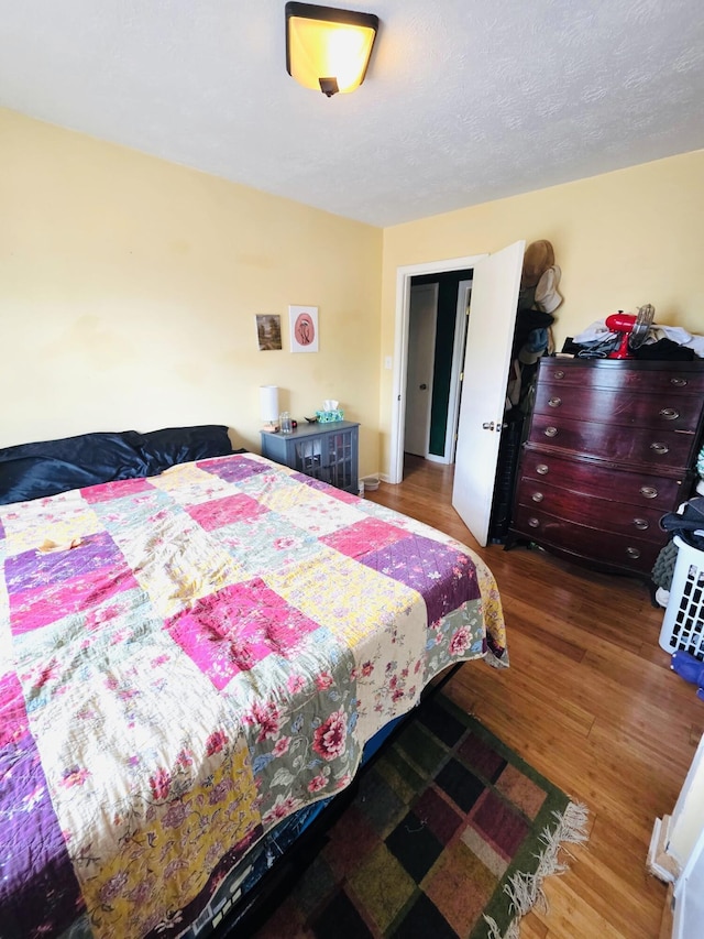bedroom featuring wood finished floors
