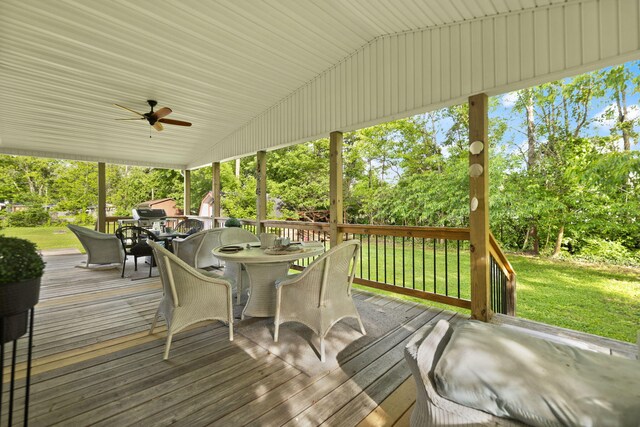 88 Plum St, Stanton, KY 40380 - wooden terrace with outdoor dining space, a ceiling fan, a lawn, and view of scattered trees