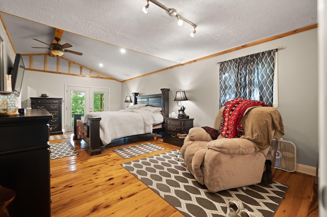 88 Plum St, Stanton, KY 40380 - bedroom with a textured ceiling, vaulted ceiling, and wood-type flooring