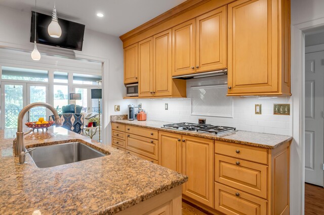 101 Idle Hour Dr Unit 1, Lexington, KY 40502 - kitchen featuring stainless steel appliances, a sink, under cabinet range hood, light stone countertops, and recessed lighting
