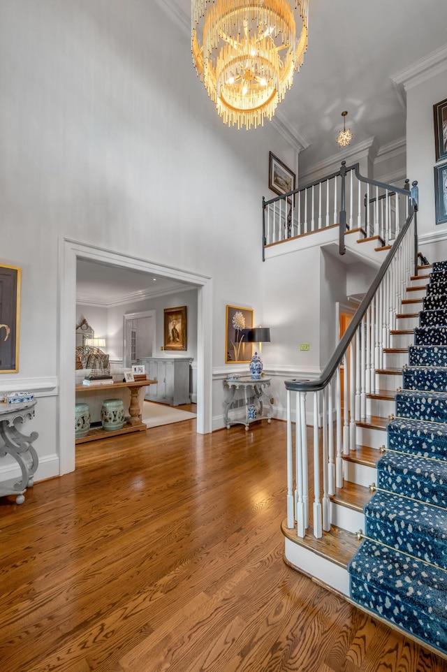 101 Idle Hour Dr Unit 1, Lexington, KY 40502 - staircase featuring a chandelier, a high ceiling, ornamental molding, and wood finished floors
