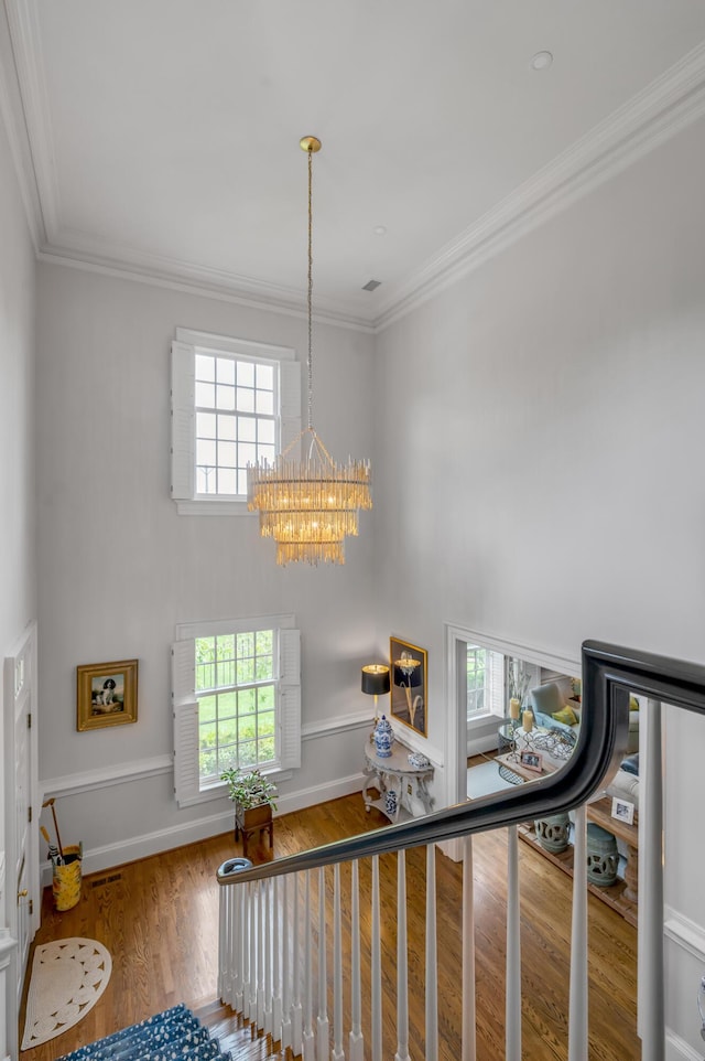 101 Idle Hour Dr Unit 1, Lexington, KY 40502 - stairs with a chandelier, wood finished floors, crown molding, and baseboards