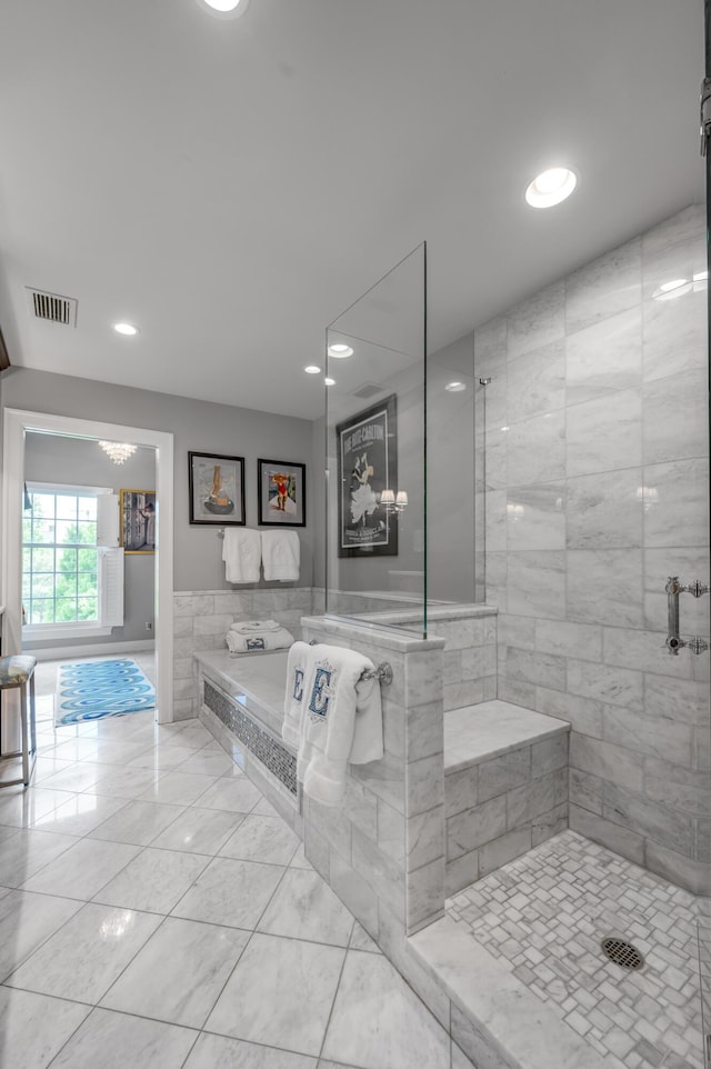 101 Idle Hour Dr Unit 1, Lexington, KY 40502 - bathroom with recessed lighting, a bath, marble look tile flooring, a tile shower, and tile walls