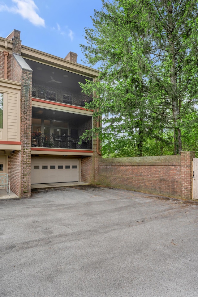 101 Idle Hour Dr Unit 1, Lexington, KY 40502 - view of property exterior featuring a garage and asphalt driveway