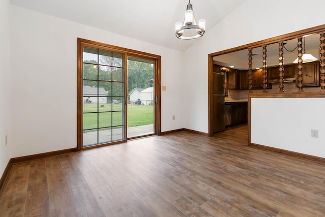 3716 Hickory Hill Dr, Somerset, KY 42503 - interior space featuring an inviting chandelier, lofted ceiling, baseboards, and wood finished floors