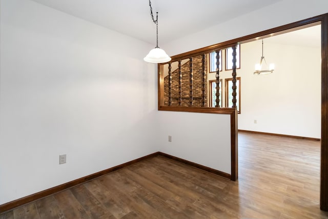 3716 Hickory Hill Dr, Somerset, KY 42503 - spare room with baseboards, a chandelier, and wood finished floors