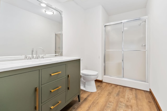 3716 Hickory Hill Dr, Somerset, KY 42503 - bathroom featuring a stall shower, toilet, and wood finished floors