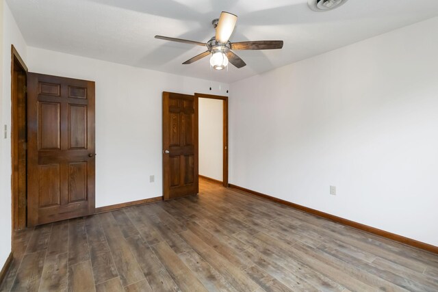 3716 Hickory Hill Dr, Somerset, KY 42503 - unfurnished bedroom featuring wood finished floors, baseboards, and a ceiling fan