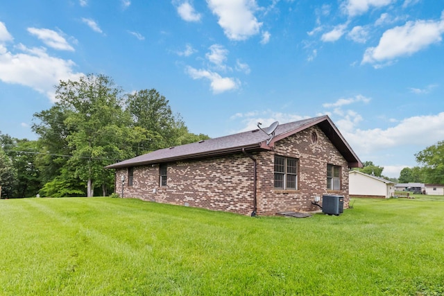 3716 Hickory Hill Dr, Somerset, KY 42503 - view of property exterior featuring a yard, central AC unit, and brick siding