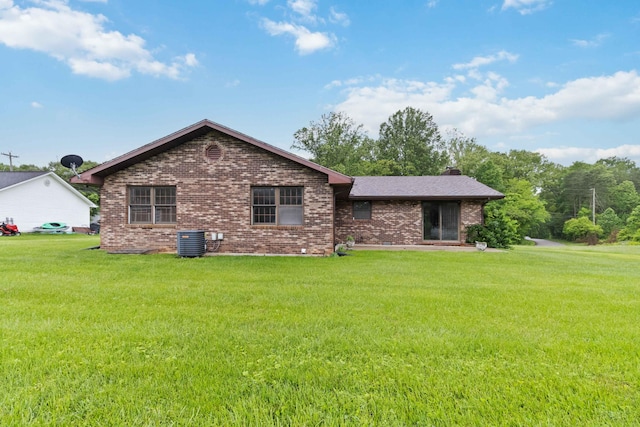 3716 Hickory Hill Dr, Somerset, KY 42503 - back of house featuring a yard, a chimney, cooling unit, and brick siding