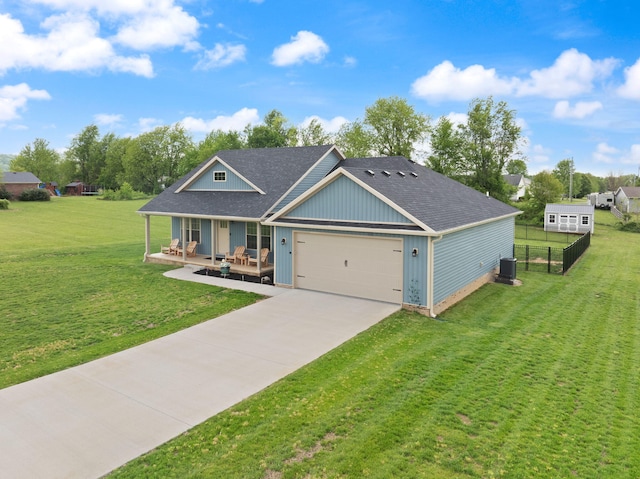 craftsman house featuring fence, an attached garage, concrete driveway, a front yard, and a porch