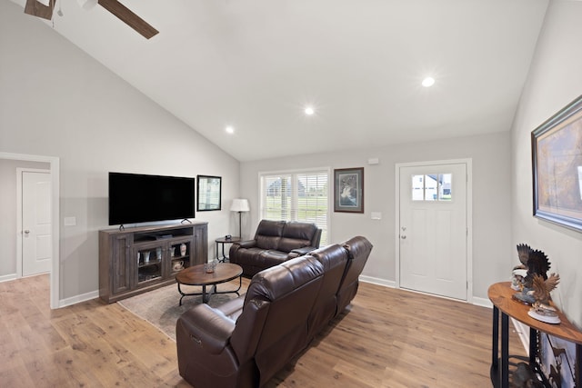 living area with vaulted ceiling, ceiling fan, light wood finished floors, and recessed lighting