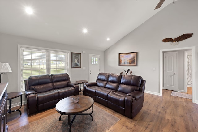 living room featuring a ceiling fan, recessed lighting, baseboards, high vaulted ceiling, and wood finished floors