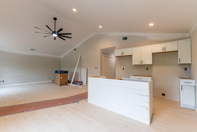 301 Meece St, Somerset, KY 42501 - kitchen featuring vaulted ceiling, light wood-type flooring, a ceiling fan, a center island, and white cabinets