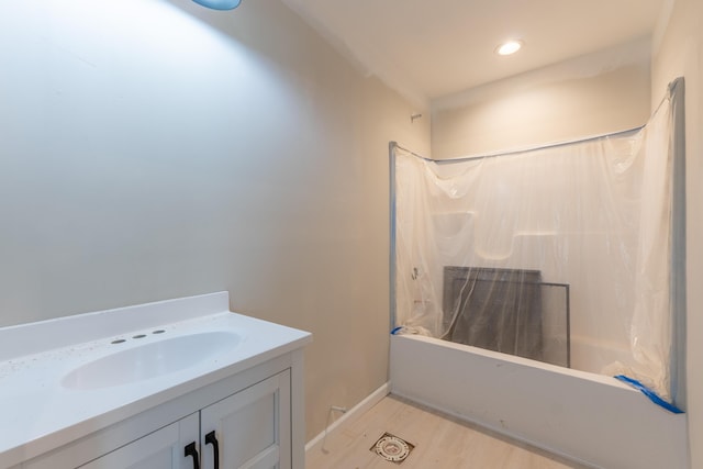 301 Meece St, Somerset, KY 42501 - full bath featuring wood finished floors, vanity, shower / bath combo with shower curtain, recessed lighting, and baseboards