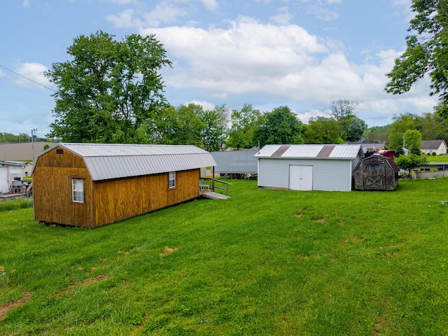 301 Meece St, Somerset, KY 42501 - view of green lawn featuring a storage shed and an outdoor structure