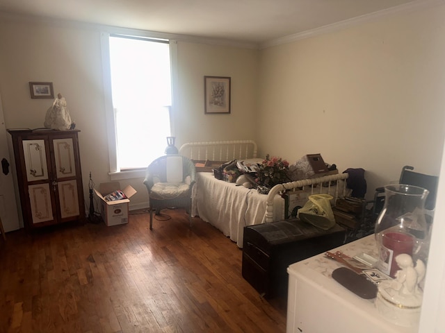 bedroom featuring dark wood-type flooring and crown molding