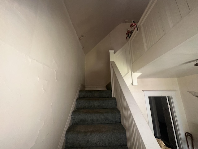 stairs featuring baseboards