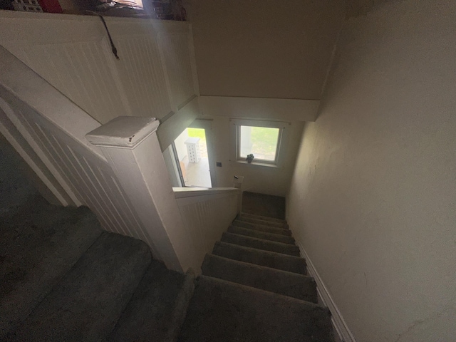 stairs featuring baseboards