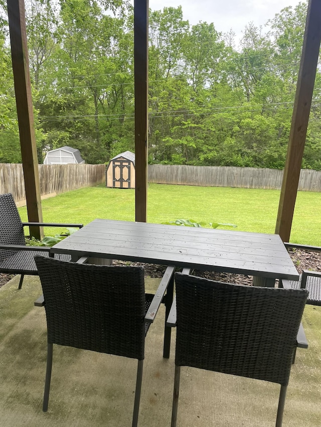 1166 Devane Ln, Frankfort, KY 40601 - view of patio with outdoor dining area, a shed, and an outbuilding