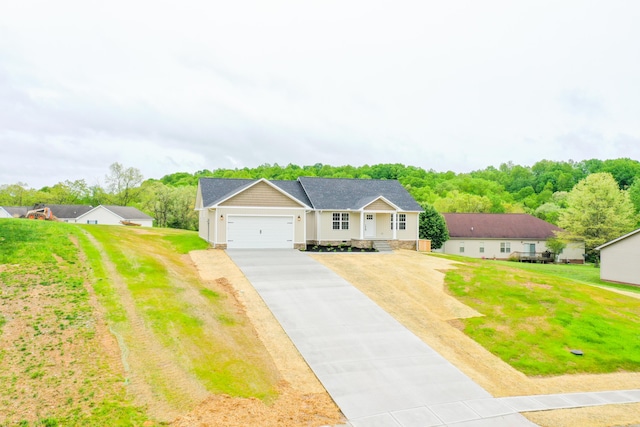 single story home with asphalt driveway, a garage, a front lawn, and a shingled roof