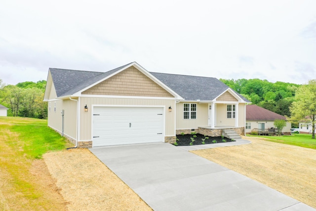 view of front of home featuring a garage, concrete driveway, a porch, a front lawn, and a shingled roof