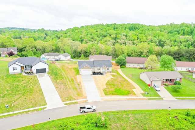 aerial perspective of suburban area featuring a forest