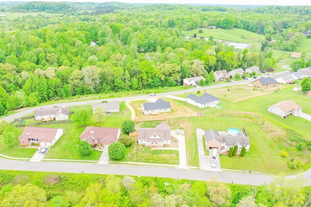 aerial perspective of suburban area with a heavily wooded area
