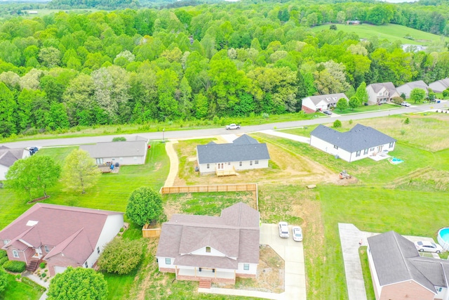 aerial view of residential area with a forest