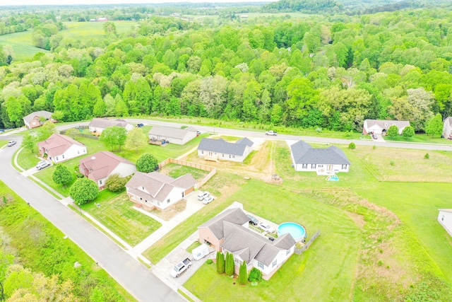 aerial perspective of suburban area with a heavily wooded area