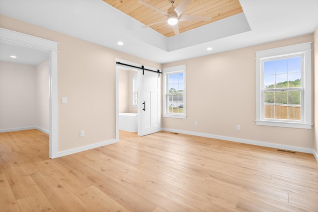unfurnished bedroom featuring multiple windows, baseboards, light wood finished floors, wooden ceiling, and recessed lighting