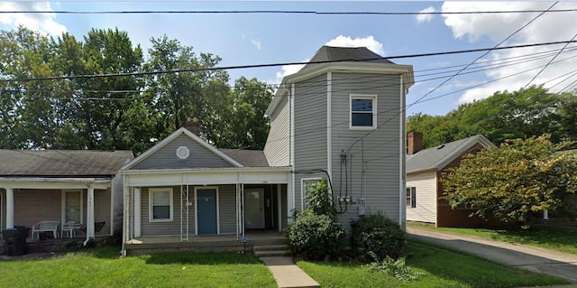 view of front of property with a porch and a front yard