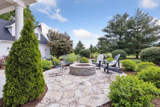 view of patio / terrace with an outdoor fire pit