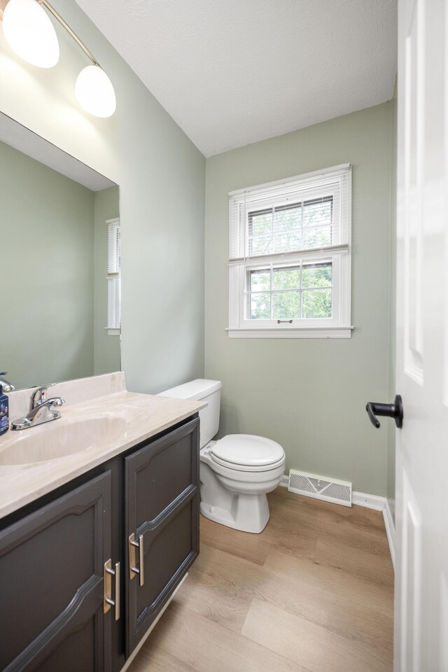 2912 Jason Ct, Lexington, KY 40503 - foyer with light wood finished floors, stairway, baseboards, and a textured ceiling
