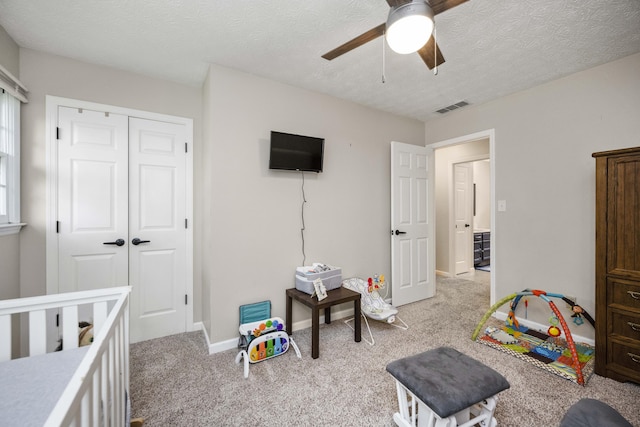 2912 Jason Ct, Lexington, KY 40503 - bedroom featuring light colored carpet, baseboards, a closet, a textured ceiling, and a ceiling fan