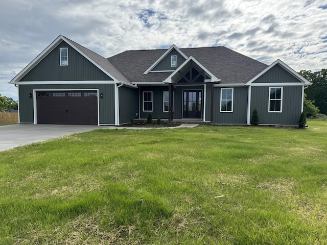 66 Driftwood Way, Corbin, KY 40701 - craftsman house featuring a front lawn, driveway, a garage, and a shingled roof