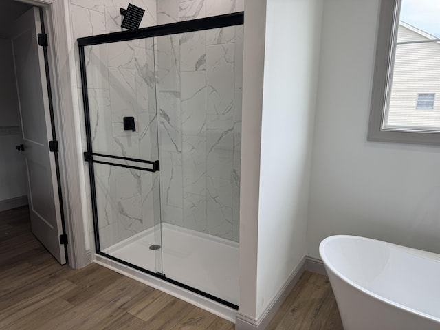 66 Driftwood Way, Corbin, KY 40701 - bathroom featuring a stall shower, a soaking tub, wood finished floors, and baseboards