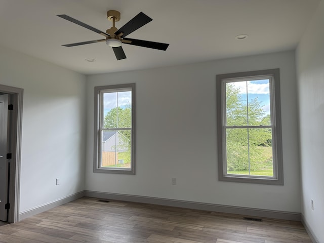 66 Driftwood Way, Corbin, KY 40701 - empty room featuring plenty of natural light, light wood-style flooring, ceiling fan, and recessed lighting