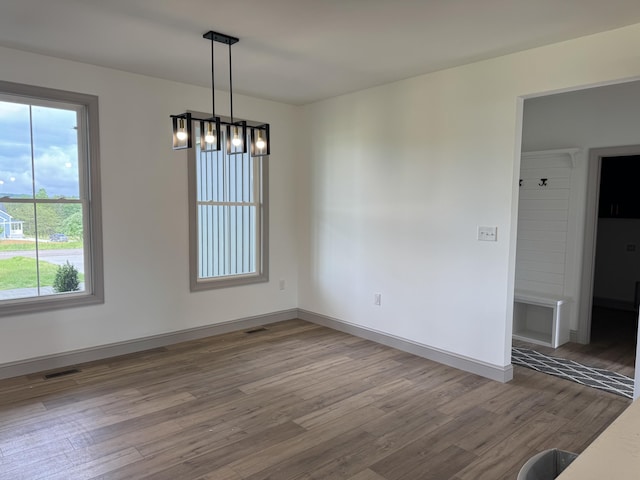 66 Driftwood Way, Corbin, KY 40701 - unfurnished dining area with wood finished floors, baseboards, and a chandelier