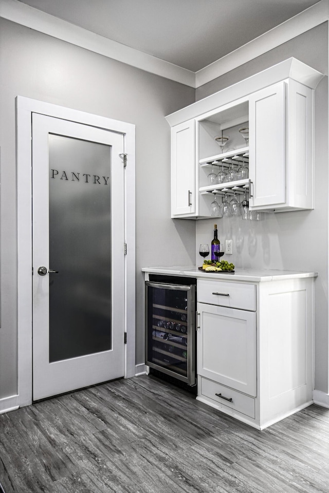 101 Creek Ridge Dr, Nicholasville, KY 40356 - indoor dry bar with wine cooler, dark wood-style flooring, and baseboards