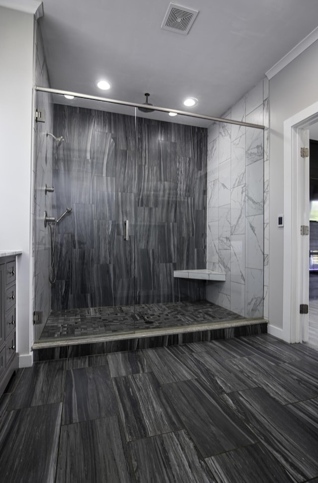 full bathroom with recessed lighting, a shower stall, and marble finish flooring