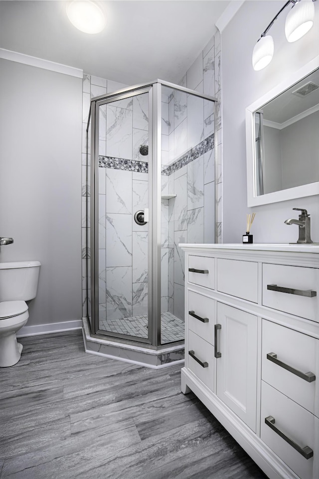 101 Creek Ridge Dr, Nicholasville, KY 40356 - bathroom with toilet, vanity, a stall shower, wood finished floors, and crown molding