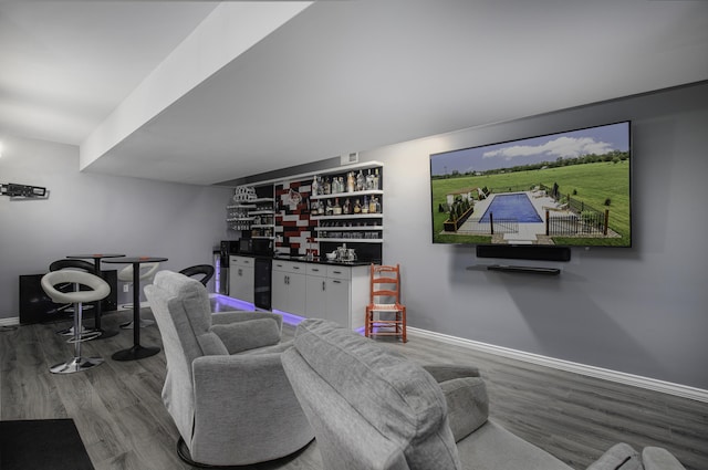 101 Creek Ridge Dr, Nicholasville, KY 40356 - living room with a bar, wood finished floors, and baseboards