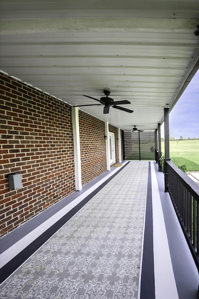 view of patio featuring ceiling fan