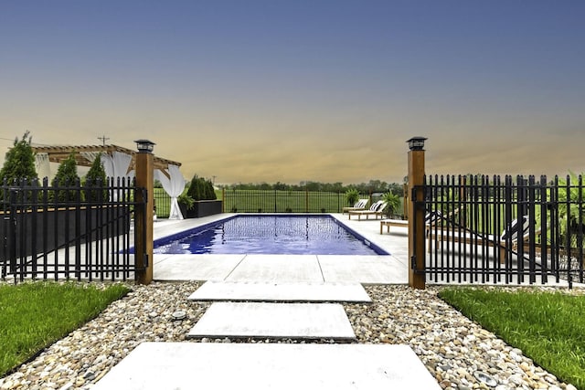 view of pool with fence and a patio area