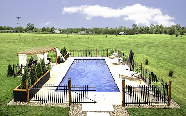 view of swimming pool with a view of countryside, a patio area, and a gazebo