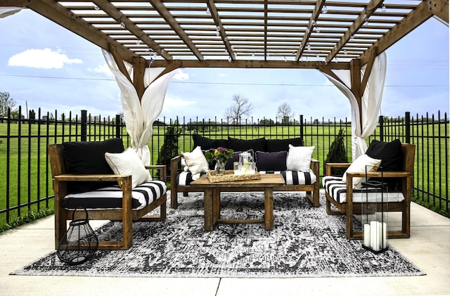 view of patio / terrace with an outdoor living space, a pergola, and a rural view