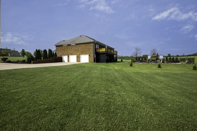 view of home's exterior with a garage, concrete driveway, and a lawn