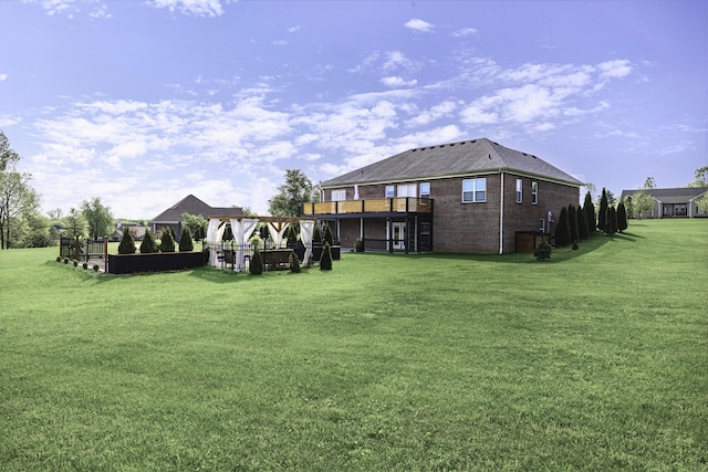 view of grassy yard with a deck