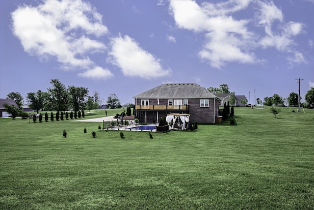 surrounding community featuring a swimming pool, a yard, and a deck